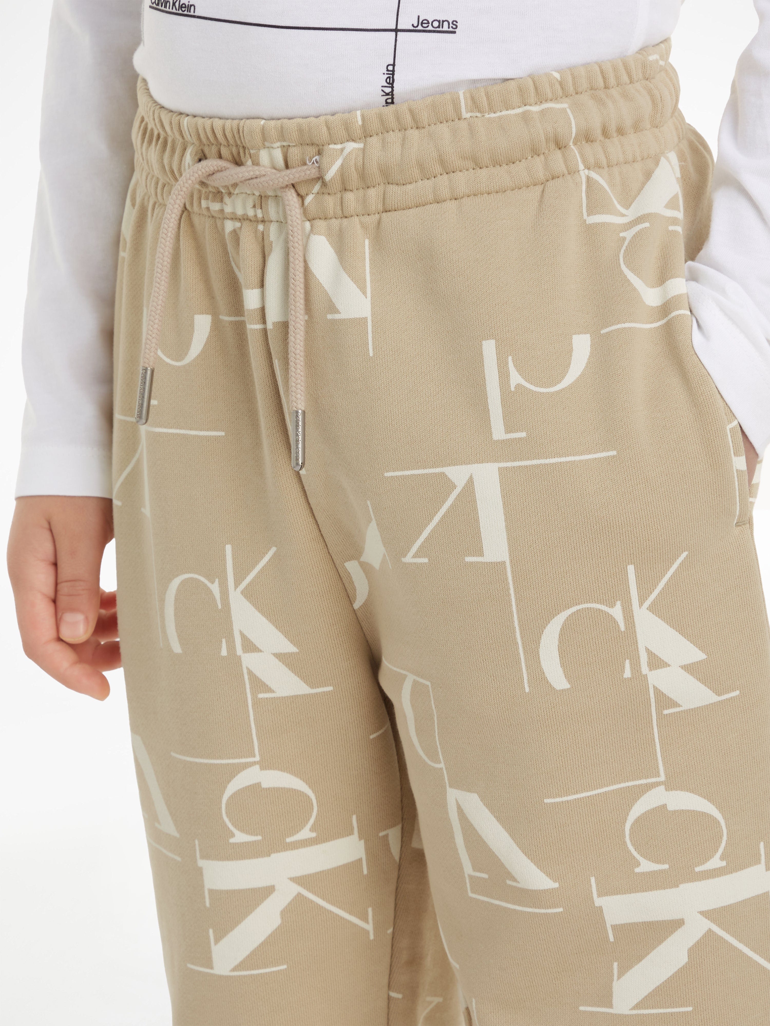 Calvin Klein Boys City Grid AOP Joggers in Beige Outlet Genuine