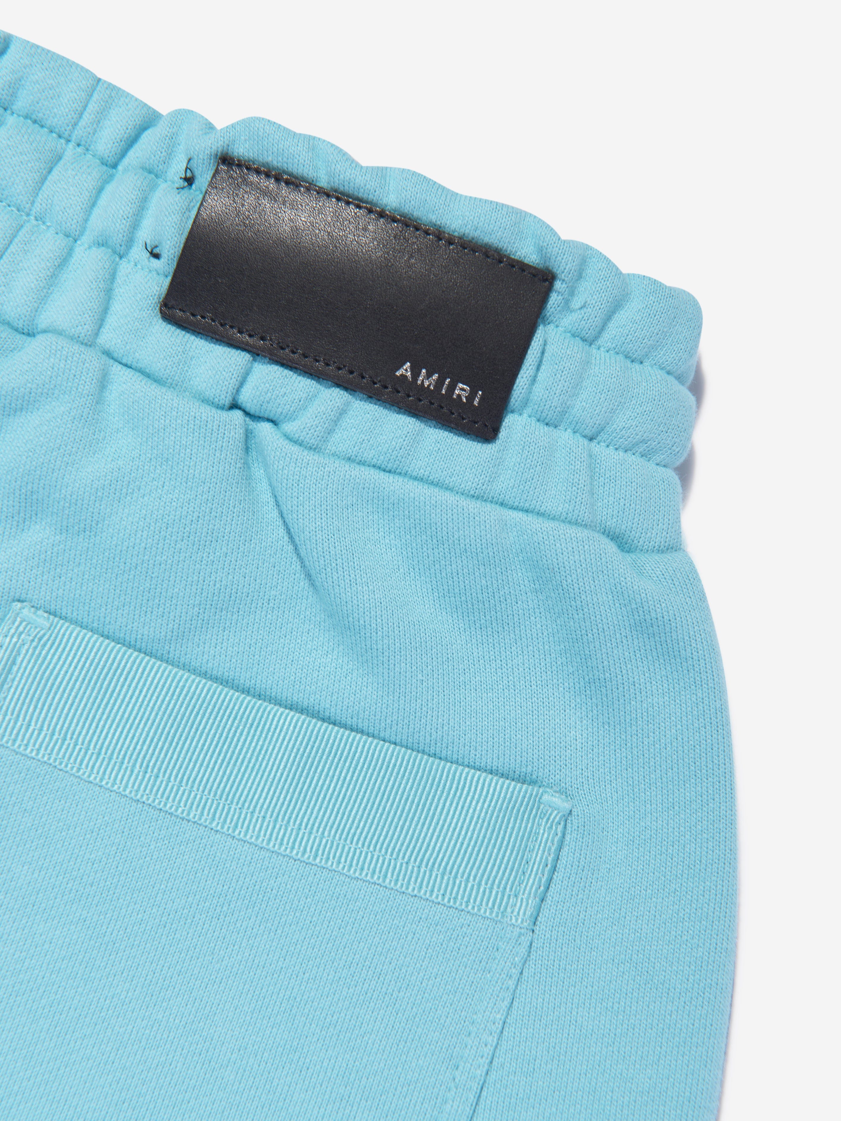 Amiri Kids Staggered Scribble Logo Joggers in Blue Clearance Clearance